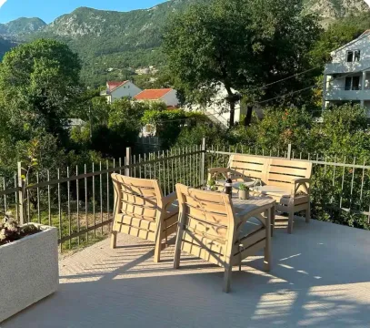 Spacious terrace with outdoor furniture and mountain views. - image 15