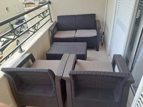 Furnished balcony with seating set. - image 6