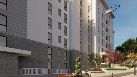 Exterior view of a modern residential building with landscaped yard. - image 3