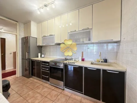 Modern kitchen with light upper and dark lower cabinets. - image 7
