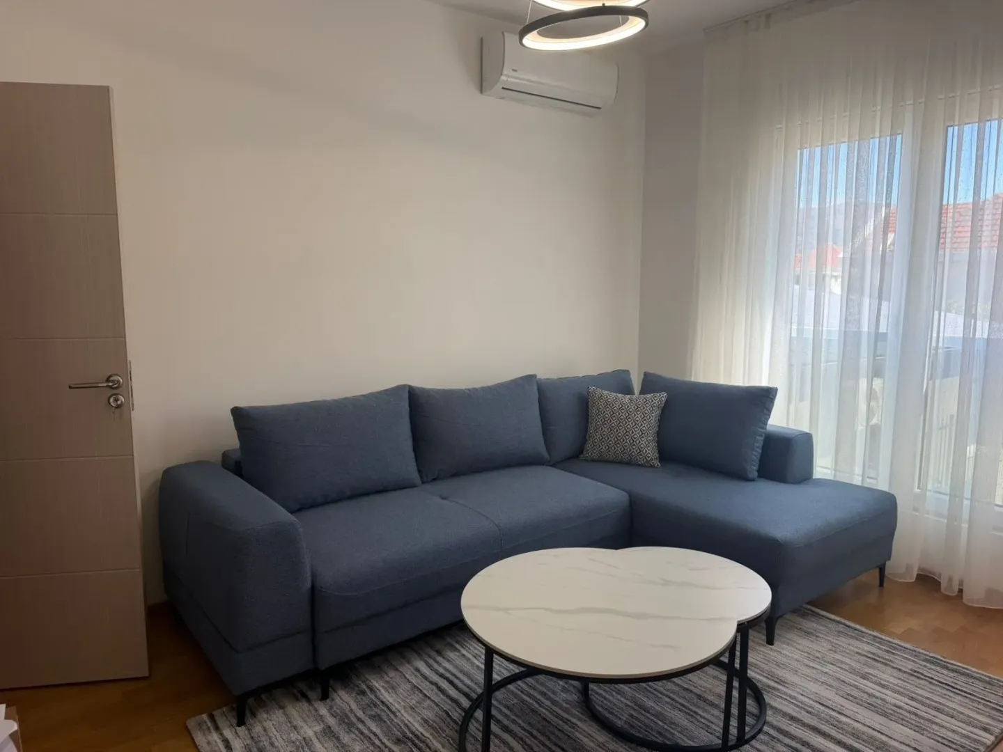Living room with a sectional sofa and a coffee table.