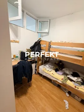Smaller bedroom with a bunk bed and a desk. - image 5