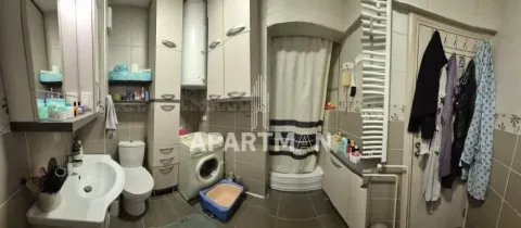 Bathroom equipped with a sink, toilet, shower cabin and washing machine. - image 11