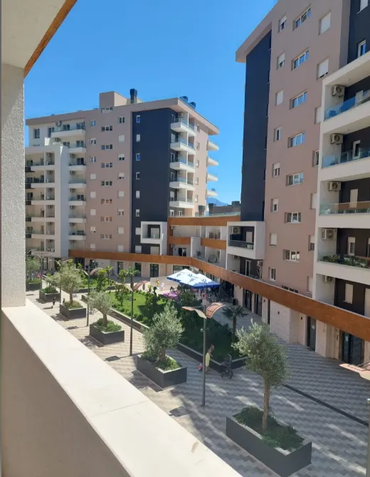 View from the terrace overlooking the courtyard and surrounding residential buildings.