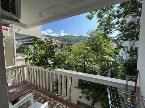 Balcony with a view of greenery and hills. - image 6
