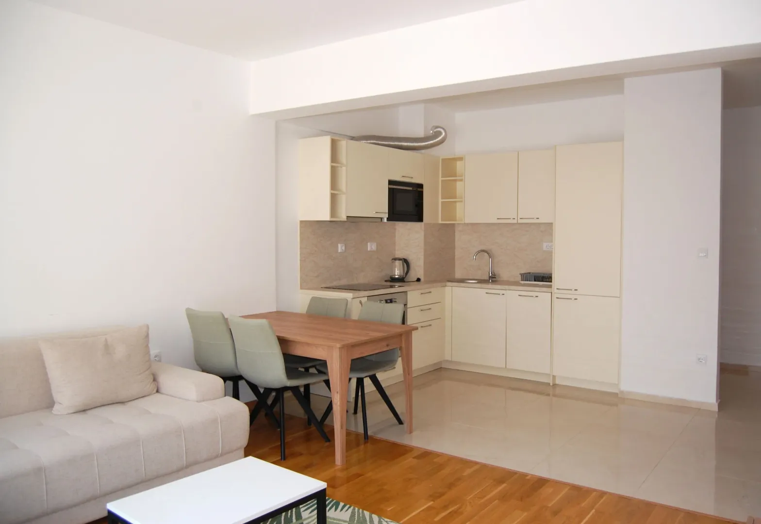 Living room with dining area and open-plan kitchen.