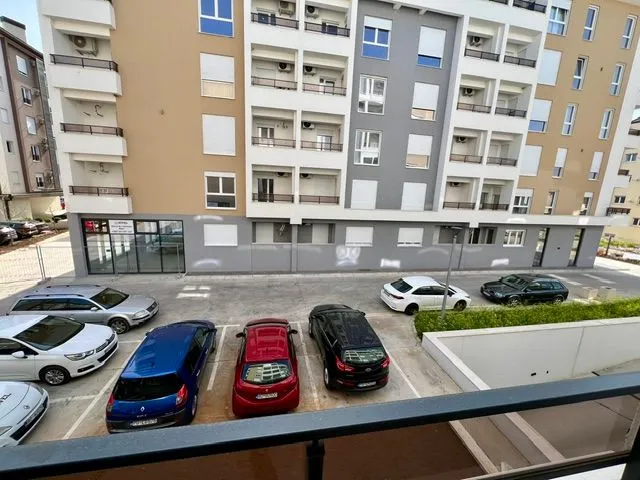 View from the terrace towards the building and parking lot.