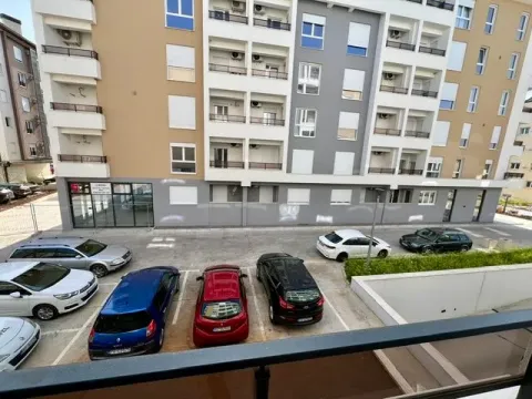 View from the terrace towards the building and parking lot. - image 10