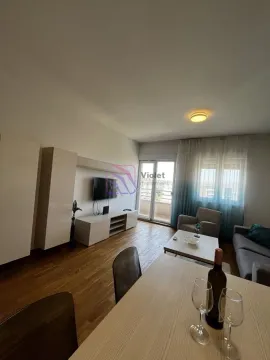 Living room with a dining area, sofa set, and access to the terrace. - image 2