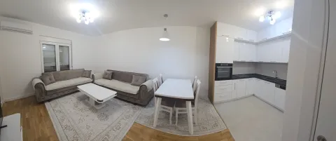 Spacious living room with an open-plan dining area and kitchen. - image 8