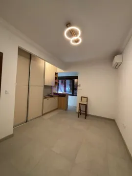 Small kitchen with built-in units and a wardrobe in the extension of the room. - image 5