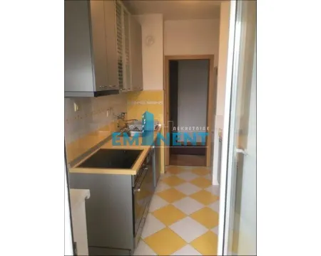 Small kitchen with cabinets and sink. - image 7
