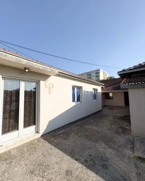 Exterior part of the house with a courtyard and paved walkway. - image 2
