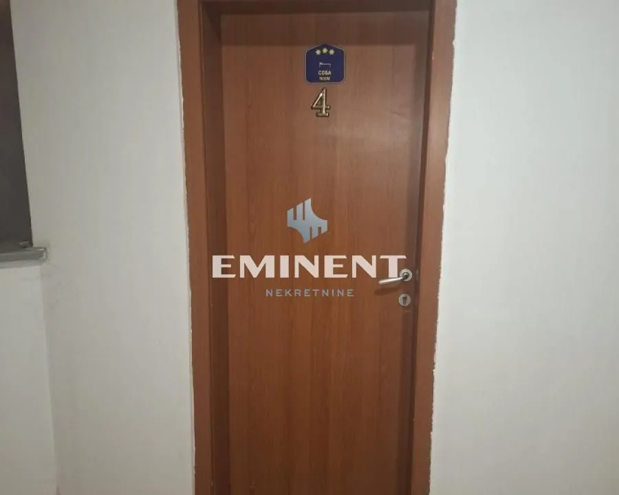 Wooden room door with the number four label.