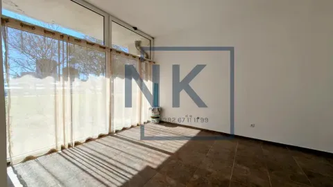 Empty room with large glass windows and tiled flooring. - image 2