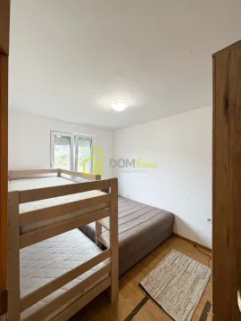 Bedroom with a bunk bed and a double bed. - image 14
