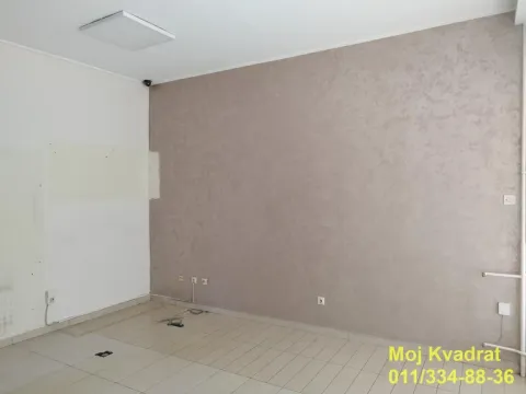 Empty room with tiled flooring and a decorative wall. - image 3