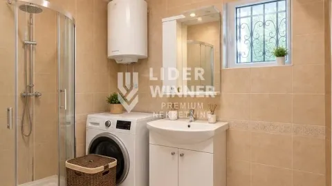 Bathroom equipped with a shower cabin, washbasin, washing machine, and water heater. - image 15
