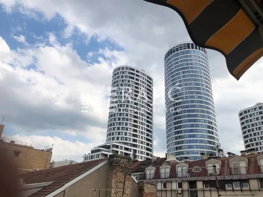 View from the terrace overlooking city buildings and skyscrapers.