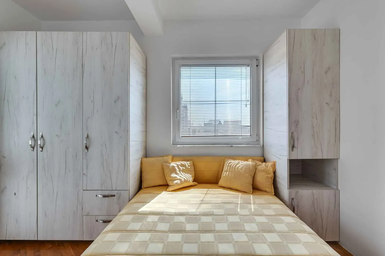 Bedroom with a double bed and built-in wardrobes.