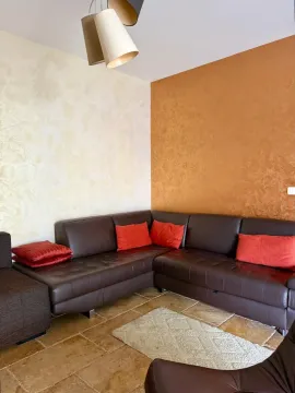 Corner sofa in the living room with decorative pillows. - image 6