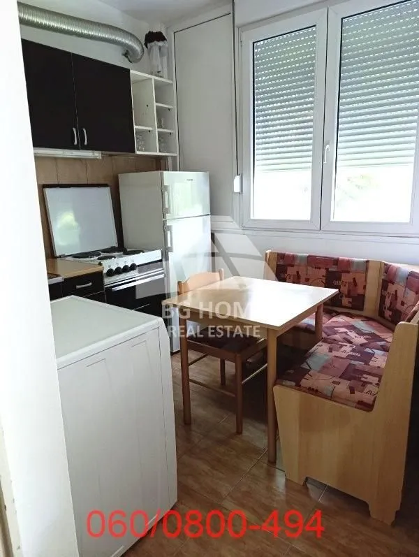 Kitchen with a dining table and a window.