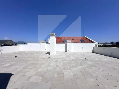 Large tiled roof terrace with surrounding views. - image 28