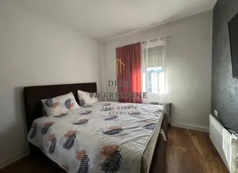 Furnished bedroom with a double bed. - image 8