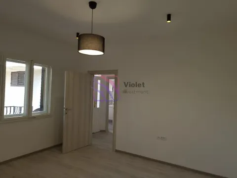 Empty room with white walls, a window, and an open door. - image 11