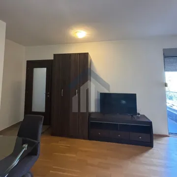 Living room with a wardrobe and a TV unit. - image 3