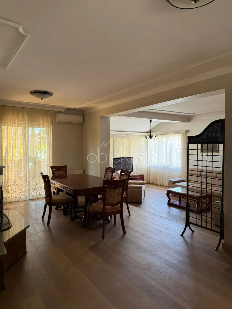 Living room with a dining area and seating furniture.