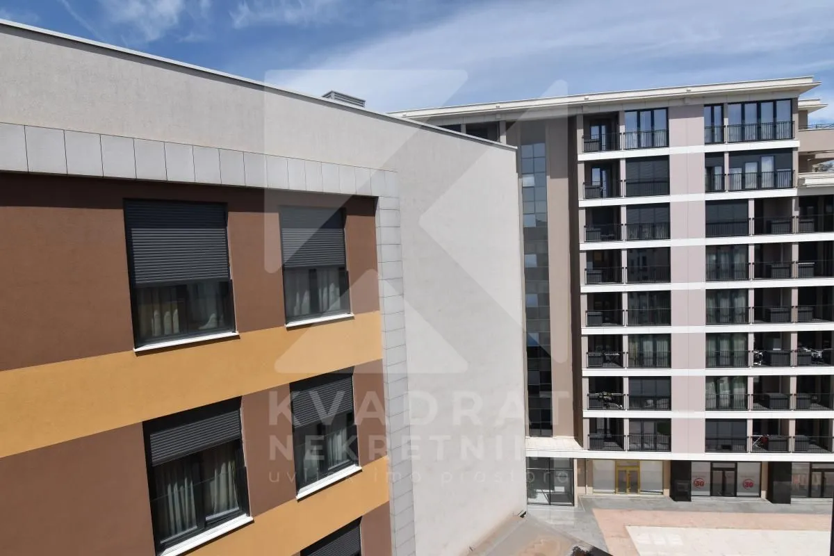 View of the exterior of modern residential buildings with windows and terraces.