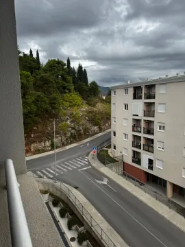 View from the terrace towards the street and adjacent building. - image 5