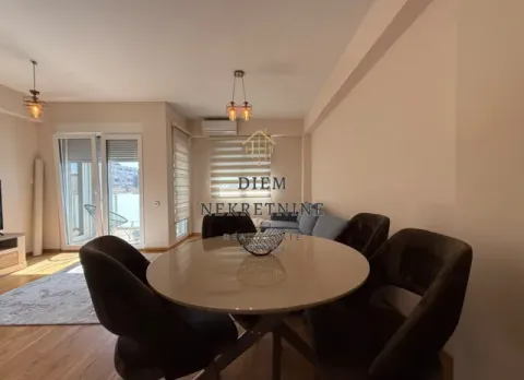 Living room with dining area and sofa. - image 6