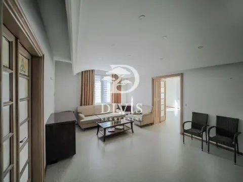 Spacious living room with a seating set and a wooden coffee table. - image 4