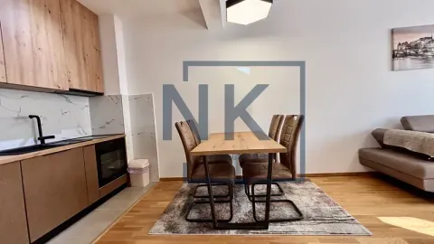Living room with dining area and kitchen in an open space layout. - image 4