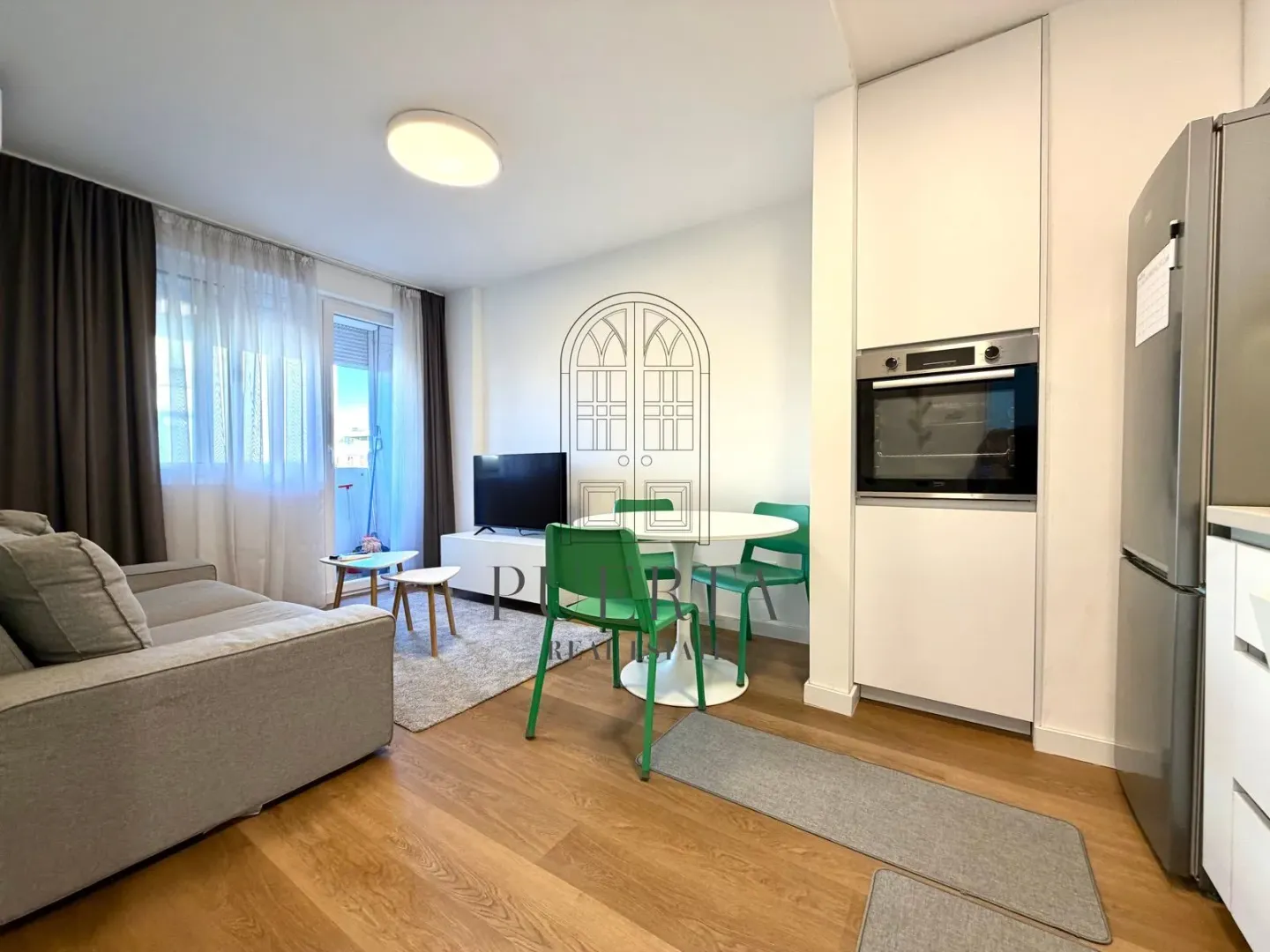 Living room with dining area and kitchen.
