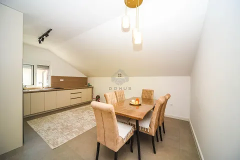 Kitchen with dining area and modern furniture in the attic. - image 2