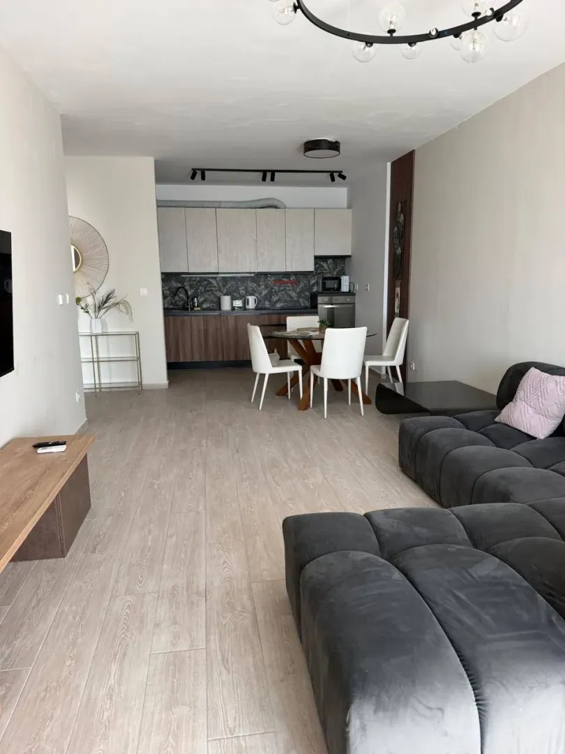 Spacious living room with dining area and kitchen.