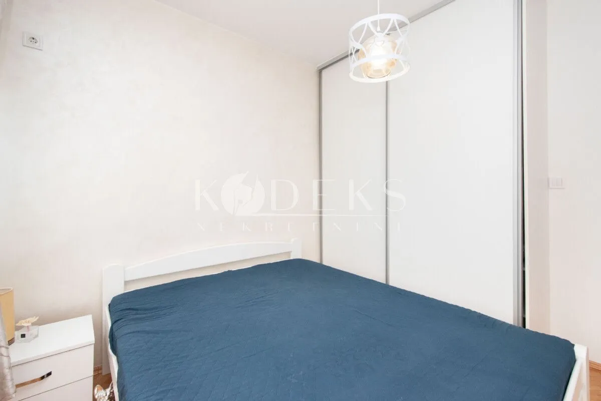 Bedroom with a double bed and a built-in wardrobe.