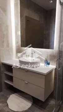 Modern bathroom with a washbasin and a large mirror. - image 19