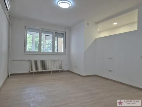 Empty bright room with a window and a radiator. - image 5