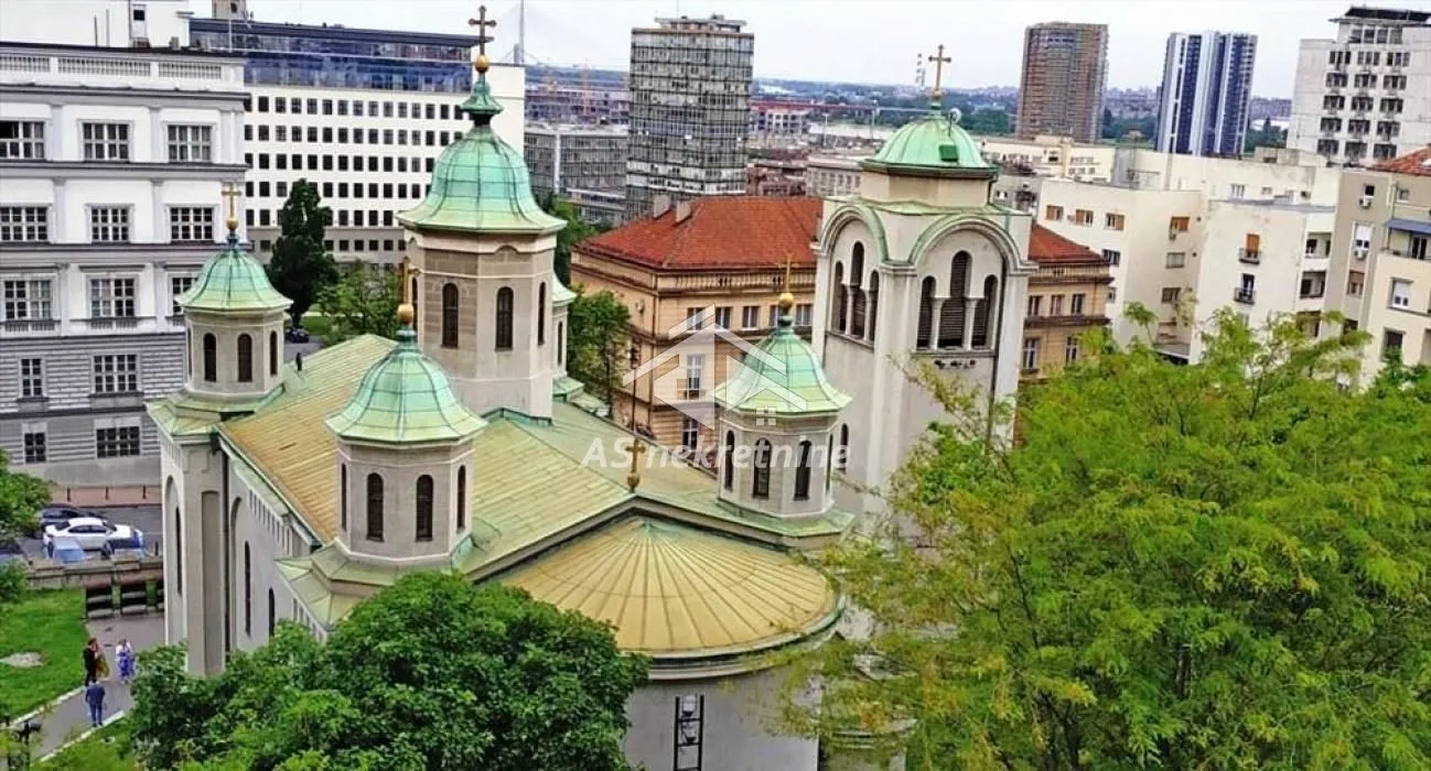 View from the window of the cityscape and the church.