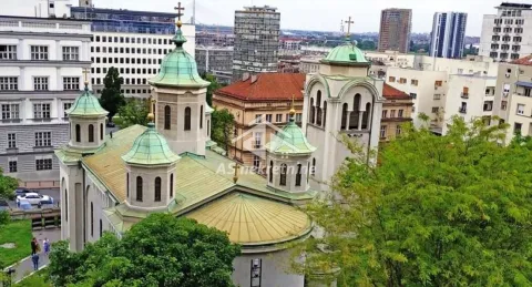 View from the window of the cityscape and the church. - image 15