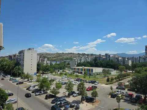 View from the terrace on the city neighborhood and parking lot. - image 12
