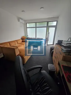 Living room with a sofa, desk, and access to the terrace. - image 7