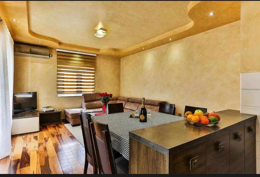 Living room with a dining area and seating set.