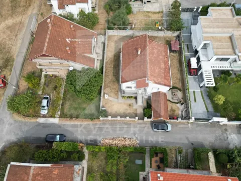 Aerial view of the house with a courtyard and surrounding buildings. - image 3