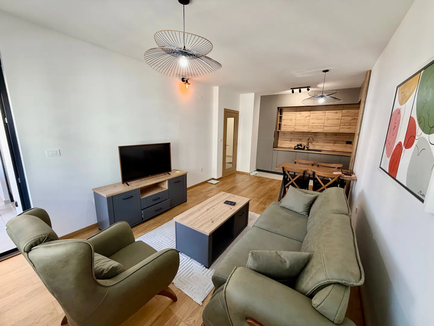Spacious living room connected to the dining area and kitchen.