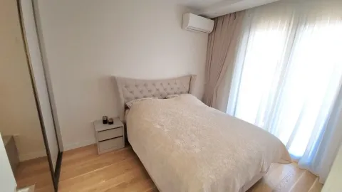 Furnished bedroom with a double bed and wardrobe. - image 9
